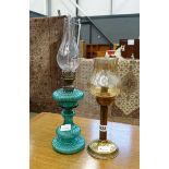 Two glass and brass oil lamps