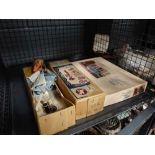 Cage containing Pelham puppet plus dolls house furniture kit