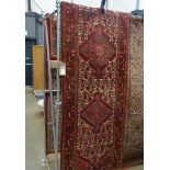 (5) Ivory and maroon carpet with geometric pattern