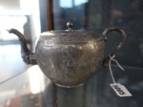 A Chinese Export pewter teapot stamped Huikee Swatow