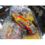 A Mettoy Playthings tinplate clockwork racing car, partial box