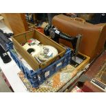 Cased Singer sewing machine, quantity of thread and buttons