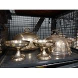 Cage containing silver plated meat cutters and dishes