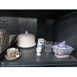 Cage containing blue and white terrine, cheese dish, egg cups, mugs and candleholders