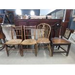 Two oak and elm chairs plus a pair of dining chairs with strug seats
