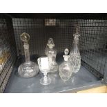 Cage containing decanters, sauce bottle and wine glass