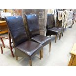 Four brown leather effect dining chairs