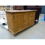 Pine double door cupboard with 3 drawers to the side