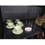 Cage containing 5 green glazed teacups and saucers, Wedgewood dish and glassware