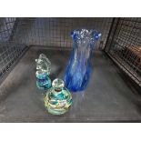 2 glass paperweights and a blue vase