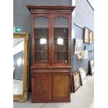 Victorian mahogany glazed double door bookcase with cupboard and drawer under