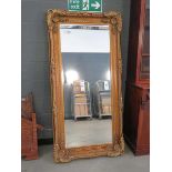 +VAT (6) Large rectangular bevelled mirror in floral gilt frame