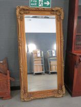 +VAT (6) Large rectangular bevelled mirror in floral gilt frame