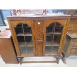 Glazed oak double door bookcase