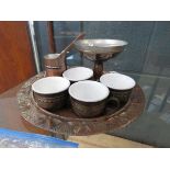 Beaten copper tray with a Chinese tea service