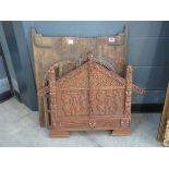 Carved Maori panel plus an Asian window panel