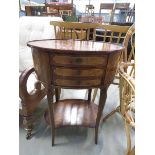 Oval walnut side table with second tier and drawers