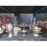 Cage containing decanters, silver plated teapots, bowl and bonbon dish