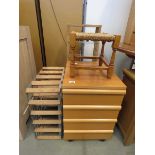 Glazed pine display stand, a wine rack, four drawer bedside cabinet and a stool