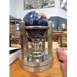 Small gemstone tabletop globe with clock and barometer under