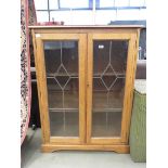 Glazed oak double door bookcase