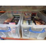 2 boxes containing CD's, DVDs and video cassettes