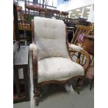 Flora upholstered armchair with exposed frame