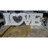 Pallet of 'Love' signs