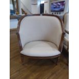 Beige upholstered tub style open armchair with limed wooden frame