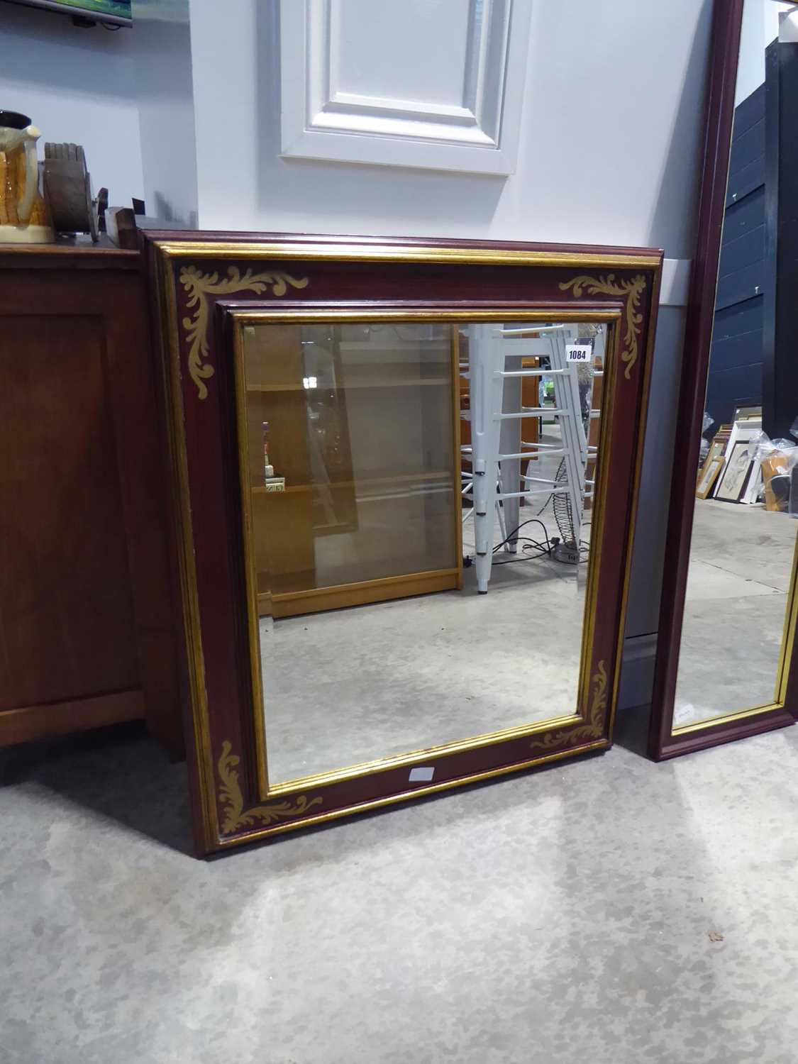 Mahogany effect and gilt, framed and beveled rectangular wall mirror