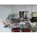 Shelf of various coinage incl. The Royal Mint 50th anniversary death of Sir Winston Churchill £5,