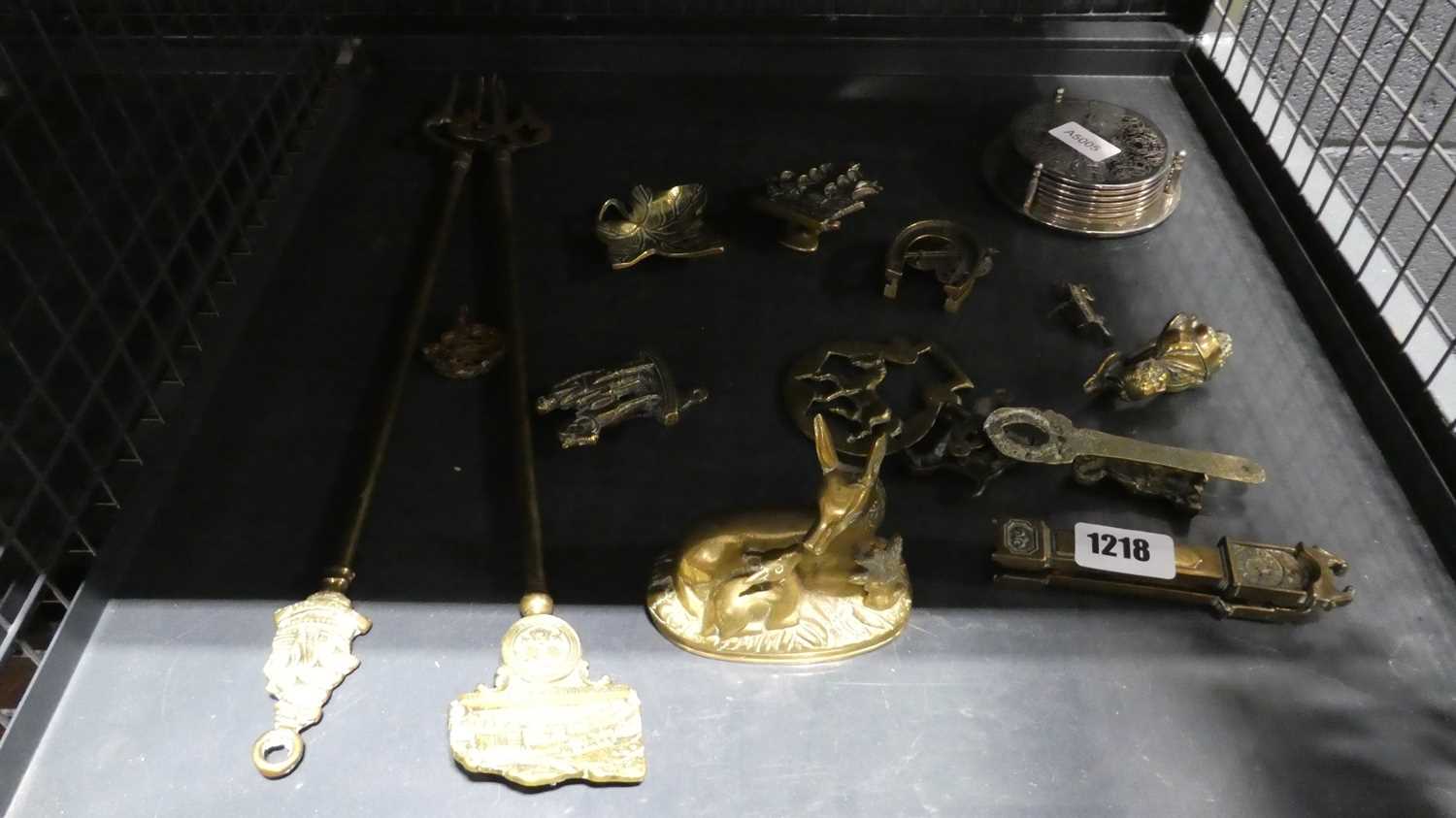 Cage of brassware including knockers, ornamental deer, fire tools, etc
