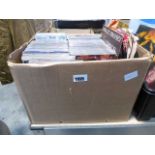 Box of various music CDs, cassettes and records