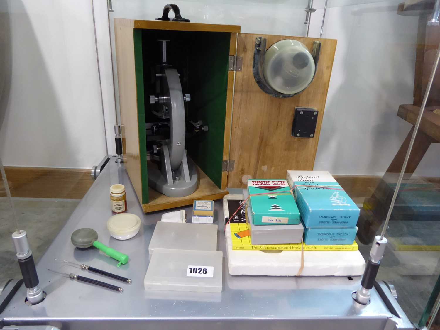 Cased microscope and various slides and accessories