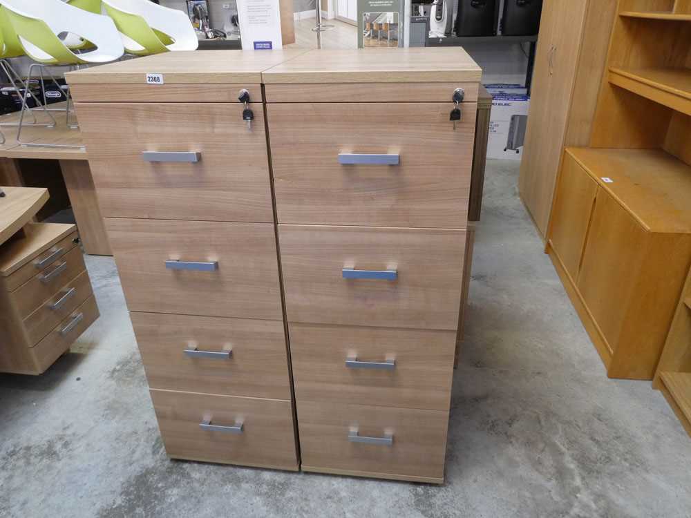 Pair of light walnut effect four drawer filing cabinet with keys