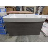 Grey wooden wall hung vanity unit with sliding drawer and built in white ceramic basin