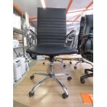 Chrome and black leatherette office swivel armchair on chrome five star base