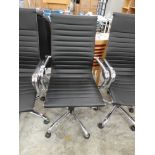 Chrome and black leatherette office swivel armchair on chrome five star base