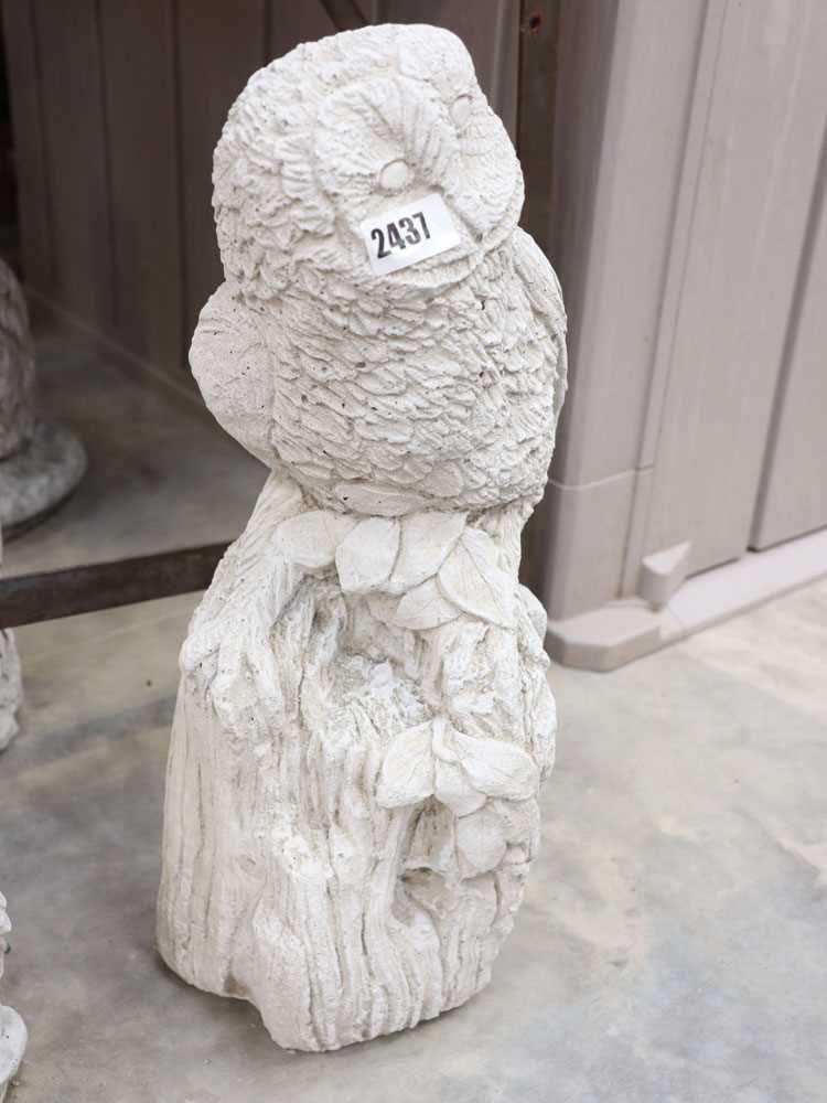 Concrete owl on stump
