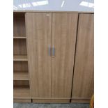 Light walnut effect two door cupboard, no key