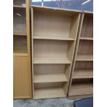 Light wood three shelf bookcase