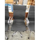 Chrome and black leatherette office swivel armchair on chrome five star base