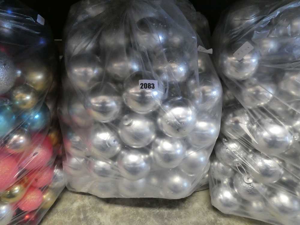 Large bag containing silver coloured Christmas baubles