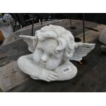 Concrete cherub bust with wings