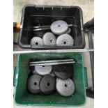 Two boxes containing various weights with lifting bar