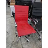 Chrome and red leatherette office swivel armchair on chrome five star base