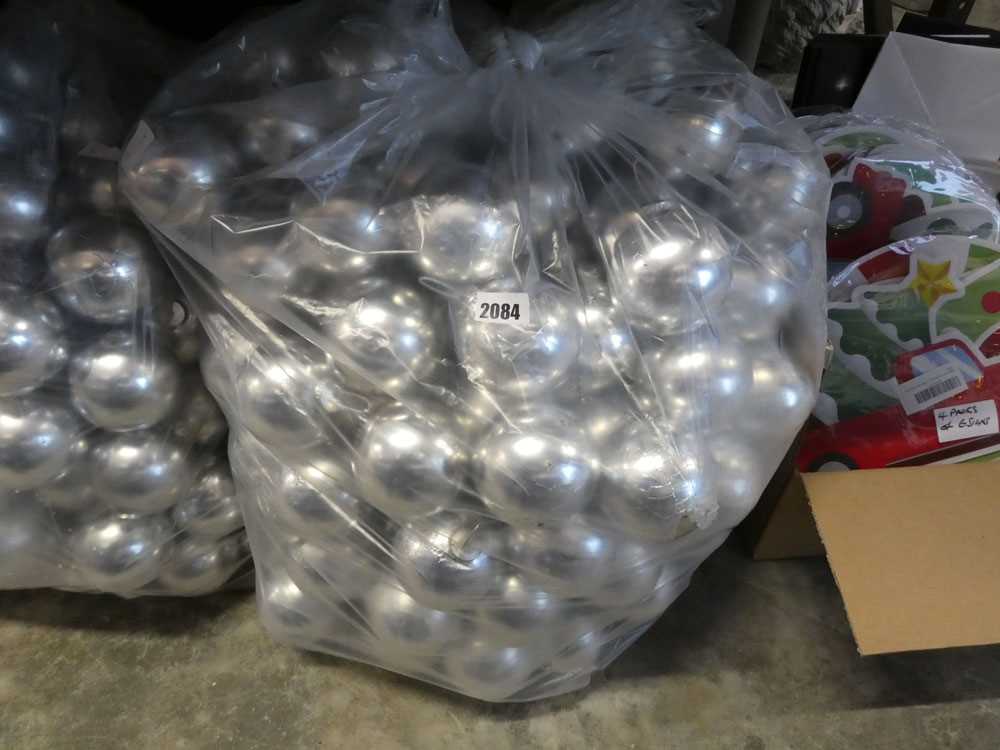 Large bag containing silver coloured Christmas baubles