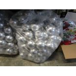 Large bag containing silver coloured Christmas baubles