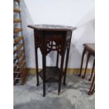 Mahogany plant stand with decoratively carved surface