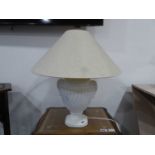 White lamp with large beige lampshade